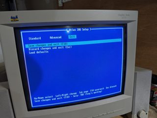 The Atlas 286 Setup Exit page with Save changes and exit, Discard changes and exit, and Load defaults